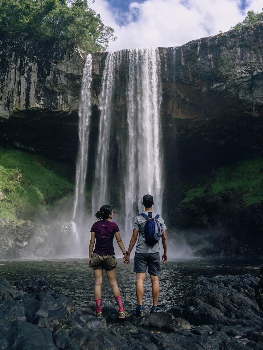 travel, wanderlust, couple, waterfalls, falls, holding hands, backpackers, backpacking, travelers, traveling, phone wallpaper, adventure, landscape, banff, trekking, trip, nature, vacation, journey, alberta, aesthetic wallpaper, iphone wallpaper